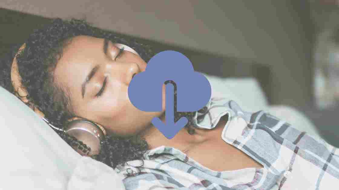 executive woman in plaid pajamas sleeping while listening to sleep meditation on headphones