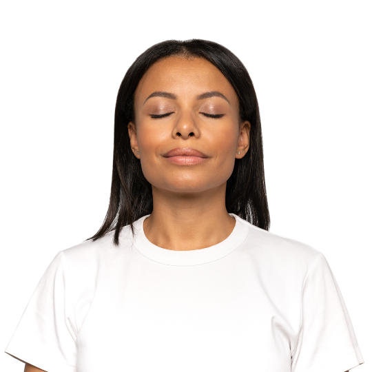 Black woman executive wearing a white t-shirt, enjoying a peaceful mind with eyes closed